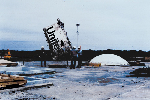 Lowering part of the Challenger into the silo